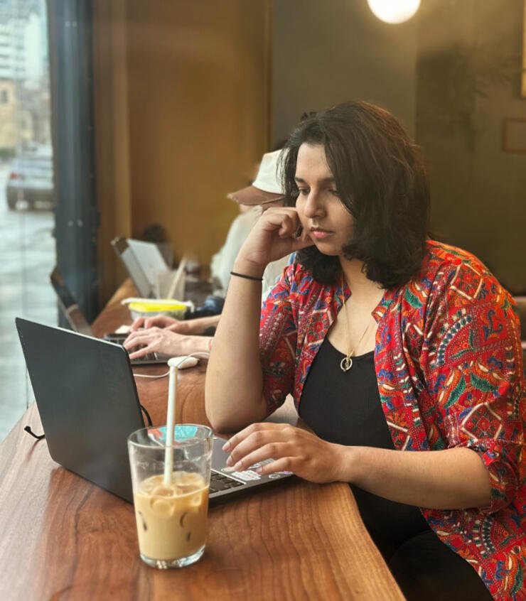 work with me image woman typing on laptop